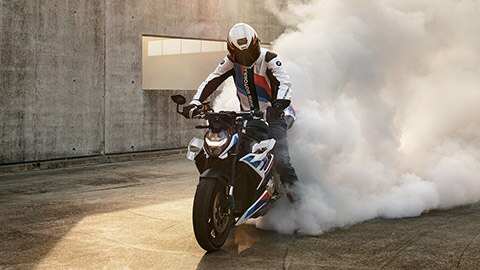 M R burning out the rear tyre