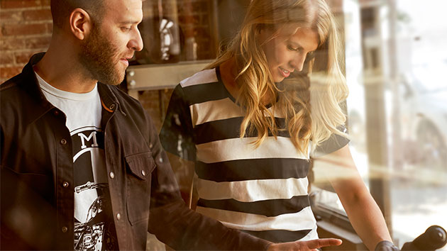 In the shot a man wears the white Dealer shirt for men.