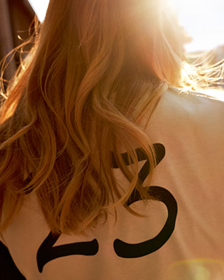 The image shows a rear view of the Boxer shirt for women.
